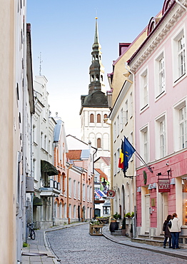 View of St. Nicholas' Church steeple from a street in the old town in Tallinn, UNESCO World Heritage Site, Estonia, Baltic States, Europe