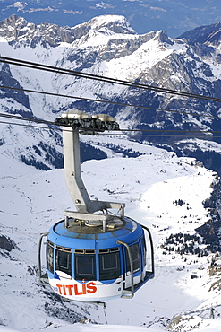 The Titlis Rotair gondola near the summit of Mount Titlis in the Swiss Alps. The gondola was the first revolving cable car in the world.