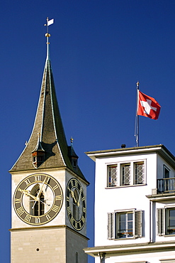 The clock tower and steeple of St Peter's church in Zürich Switzerland. It has the largest clock face in Europe (8.7m).