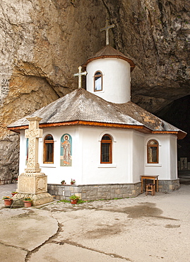 The monastery at the entrance to Ialomicioara Cave in the Bucegi mountains of the Transylvania region of central Romania, Europe