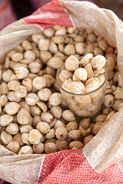 Macadamia nuts for sale in the market of Wuring fishing village near Maumere on Flores island, Indonesia.