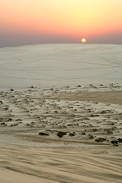 Sunset over the Inland Sea (Khor al Adaid) in southern Qatar. 