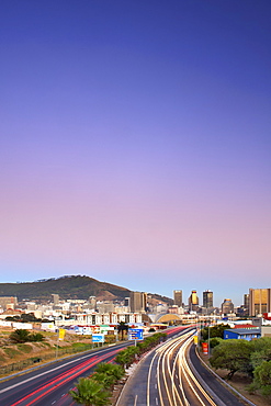 Early morning view of traffic trails on Eastern Boulevard leading into the city of Cape Town, South Africa.