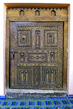 A carved door to a room in the Palais Sebban riad in Marrakech, Morocco