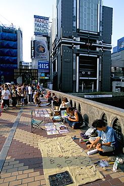 Pedestrian bridge with street traders on the Dotombori River in Minami, city centre district, Osaka, Japan, Asia