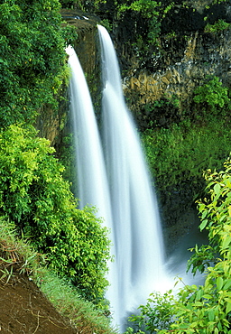 East Wailua Falls cuts back through volcanic rock on the lush slopes inland from Wailua on the east coast of Kauai, the 'Garden Island', Kauai, Hawaii, USA