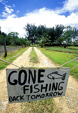 'Gone Fishing' sign outside resort on the north coast, Efate Island, Vanuatu