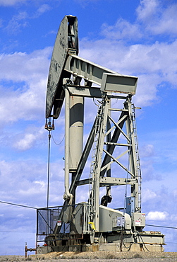 Working pumpjack near Rangely in the desert plateau oilfields of the Rio Blanco area in the far north west. War needs stimulated drilling here in the 1940s, north west, Colorado, Utah, United States of America (USA), North America