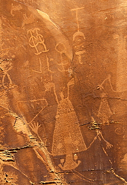 Petroglyphs carved 1000 years ago by Fremont Native American people in the iron oxide 'desert varnish' on the sandstone of Cub Creek Valley in this fossil park, Dinosaur National Monument, Utah, United States of America (USA), North America