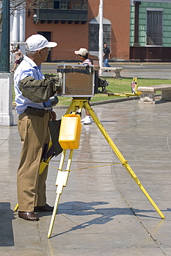 Photographer with old-fashioned camera on the Plaza de Armas in the capital of the north, Trujillo, Peru, South America