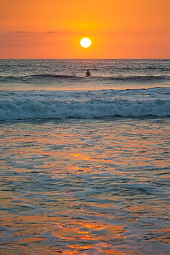 Sunset at Playa Guiones surfing beach, Nosara, Nicoya Peninsula, Guanacaste Province, Pacific coast, Costa Rica, Central America