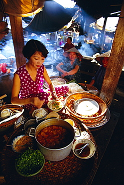 Woman preparing food at a stall in the market, Hoi An, Vietnam, Indochina, Southeast Asia, Asia