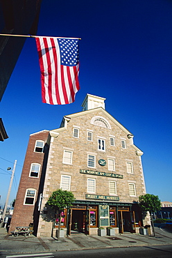 The Stars and Stripes flying before the Newport Bay Club and Hotel, downtown Newport, Rhode Island, New England, United States of America, North America