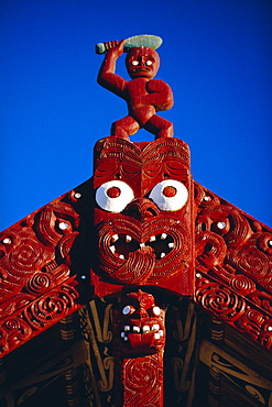 Carved portal of a church in a Maori village at the Whakarewarewa thermal and cultural area in Rotorua, North Island, New Zealand 