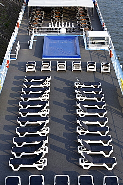 Two rows of aligned empty deckchairs on the deck of a cruise ship on the Rhine, Ruhrort, Duisburg, Ruhr Area, North Rhine-Westfalia, Germany, Europe