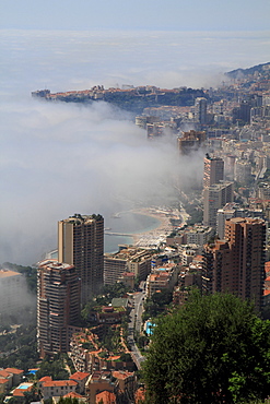 Principality of Monaco with fog over the sea, Cote d'Azur, Mediterranean Sea, Europe