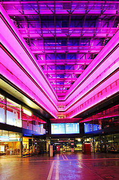 Neon-lit entrance hall of the train station in Zug, Switzerland, Europe