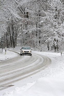 Traffic on a snow-covered country road, Baden-Wuerttemberg, Germany, Europe