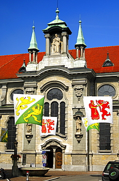 Flags with the coat of arms of the canton of Thurgau and the Frauenfeld village in front of the Catholic church of St Nikolaus, Frauenfeld, Canton Thurgau, Switzerland, Europe