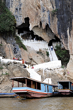 Boats on the Mekong river near the Pak Ou caves, near Luang Prabang, Laos, Southeast Asia