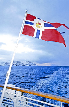 Flag on the stern of a Hurtigruten postal service boat, Norway, Europe