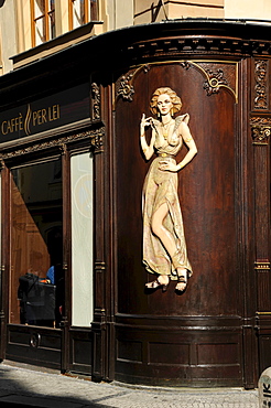 Art Nouveau house emblem of a lascivious woman, wood relief on the facade of the Caffe per Lei Cafe, historic district, Prague, Bohemia, Czech Republic, Europe