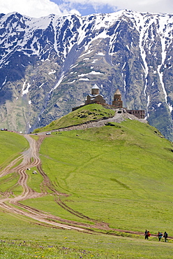 The famous Gergeti Trinity Church or Tsminda Sameba at the Chechen border, Stepantsminda, Georgia, Caucasus, Middle East