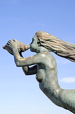 Sculpture of a mermaid blowing a chonch shell, La Magdalena peninsula, Santander, Cantabria, Spain, Europe