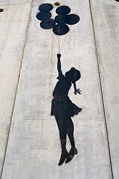 A banksy graffiti on the separation wall, Palestine, Middle East