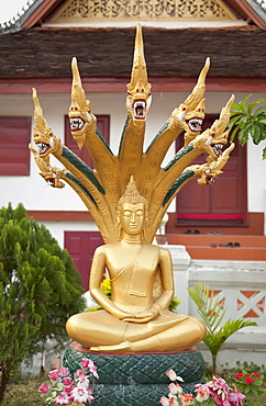 Sitting Buddha statue at Wat Mai Suwannaphumaham, Luang Prabang, Laos, Southeast Asia