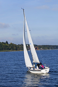 Sailboat beating on Lake Chiemsee, Upper Bavaria, Bavaria, Germany, Europe