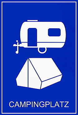 Blue sign, Campingplatz, German for campsite, with caravan and tent