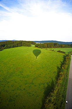 Balloon ride, hot air balloon throwing shadow