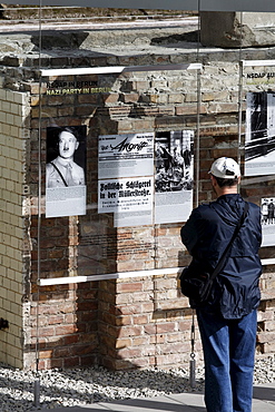 Visitor reading an information panel at the former site of the Gestapo, ss and Reich Security Main Office, Topography of Terror exhibition, Berlin, Germany, Europe