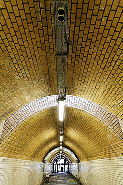 Long, illuminated pedestrian tunnel, disused Suedbahnhof railway station, Krefeld, North Rhine-Westphalia, Germany, Europe