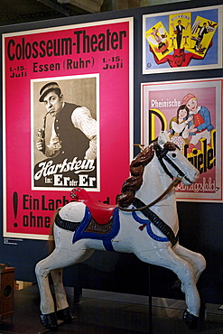 Historic poster of the Colosseum Theater Essen and a carousel horse, New Ruhr Museum, Zollverein Coal Mine Industrial Complex, Essen, North Rhine-Westphalia, Germany, Europe