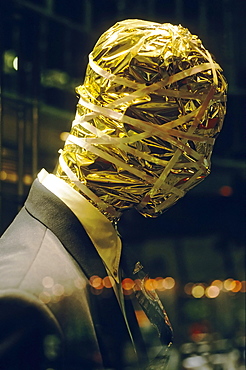 Male mannequin, head wrapped in gold paper, Koenigsallee, Duesseldorf, North Rhine-Westphalia, Germany, Europe