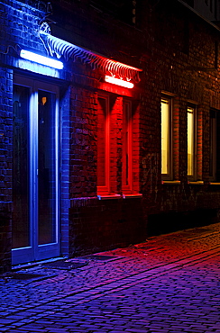 Alley in the historic district, nice ambiance, blue illuminated door, red illuminated window, Duesseldorf, North Rhine-Westphalia, Germany, Europe