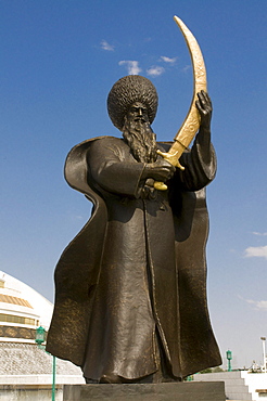 Statue with a sword in front of the Monument to the Independence of Turkmenistan, Ashgabat, Turkmenistan, Central Asia