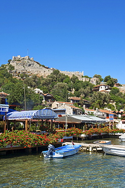 Castle and scenic restaurants in Kale Simena, Lycia, southern coast of Turkey, Western Asia