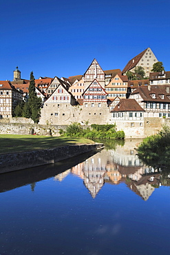 Houses of the old town reflected in the Kocher river, Schwaebisch Hall, Hohenlohe, Baden-Wuerttemberg, Germany, Europe