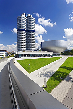 BMW Tower with the BMW Museum on Mittleren Ring, the central ring road near the Olympic Centre, Munich, Upper Bavaria, Bavaria, Germany, Europe