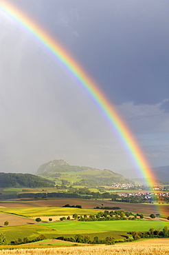 View on Mt. Hohentwiel through a rainbow, Hegau region, Landkreis Konstanz county, Baden-Wuerttemberg, Germany, Europe