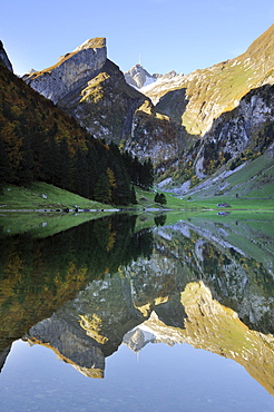 Early morning mood after sunrise looking over Seealp Lake, at 1143 m altitude, towards Rossmad Mountain, 2103 meters high, right behind, Saentis Mountain, Canton of Appenzell Inner-Rhodes, Switzerland, Europe