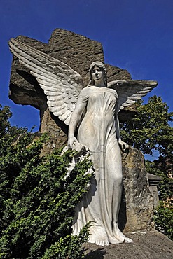 Big statue of an angel on a 19th century grave against a blue sky, Johannisfriedhof cemetery, founded in the 13th century, Brueckenstrasse street 9, Nuremberg, Middle Franconia, Bavaria, Germany, Europe