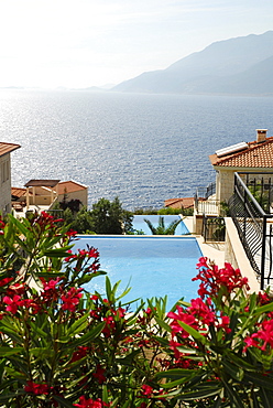 Houses with swimming pools on the Cukurbag peninsula, Kas, Lycian coast, Antalya Province, Mediterranean, Turkey, Eurasia