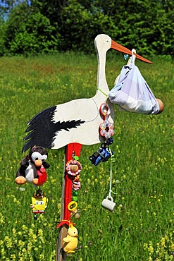 Stork showing the birth of a child, local custom, Reit im Winkl, Bavaria, Germany, Europe