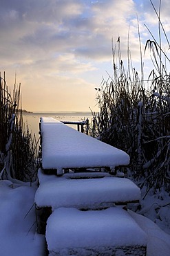 Snow on old wooden pier, lake Chiemsee, Chiemgau, Upper Bavaria, Germany, Europe