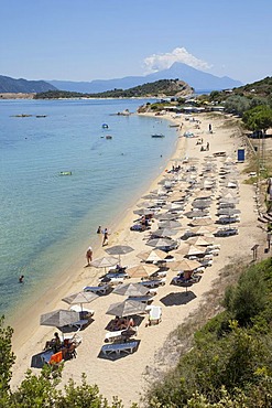 Sandy beach on the small island Amouliani off the Athos Peninsula in Chalcidice with Mount Athos in the back, Central Macedonia, Greece, Europe