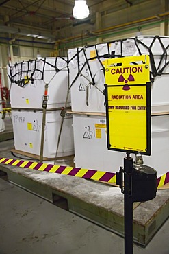 Containers filled with transuranic nuclear waste from America's nuclear weapons program await burial at the Waste Isolation Pilot Plant; the radioactive materials are then stored in rooms carved out of an ancient salt formation a half mile below the Chihu